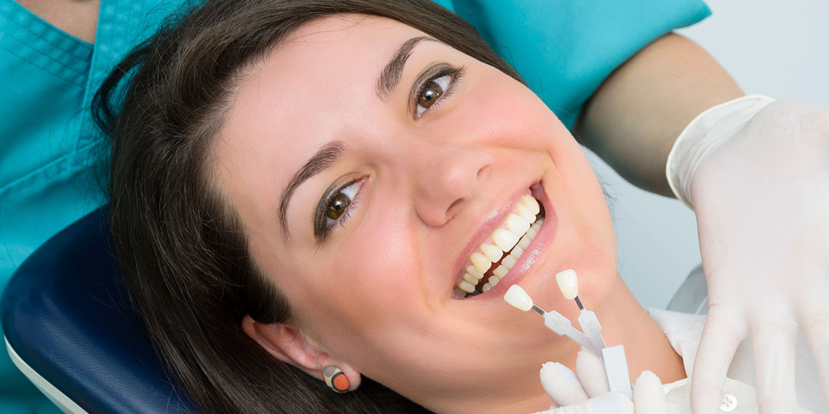 woman smiling after getting dental cosmetic bonding