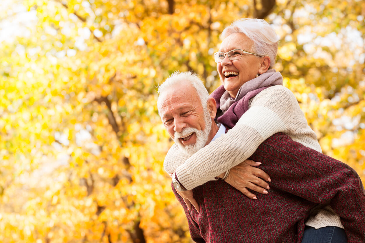 Senior couple with dentures smiling and laughing