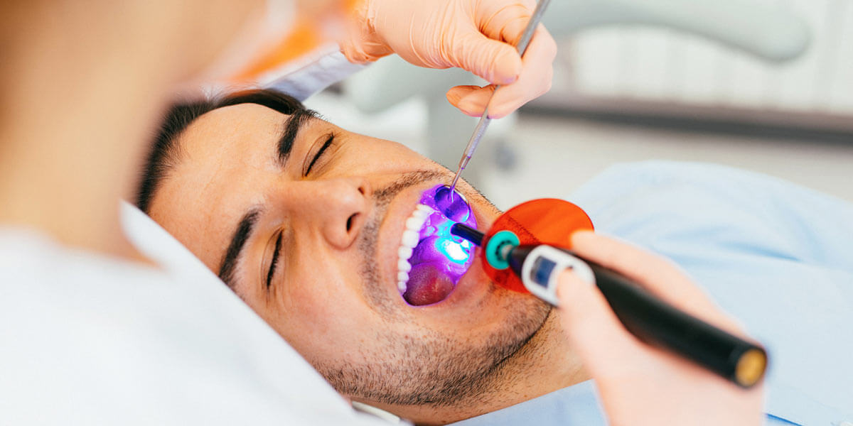 Man examined for dental sealants.