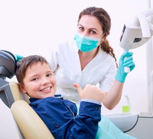 Young child receiving dental examination.